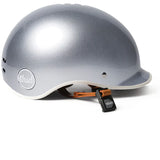 Side profile of the Thousand Heritage 1.0 Helmet in So Silver on a flat white surface.