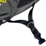 Close-up detail of the helmet’s black foam interior and chin strap, showing a partial CE label on the foam and a plastic buckle with “PAT.” text, set against a white background.